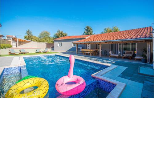 Amazing home in Pakostane with 2 Bedrooms, WiFi and Outdoor swimming pool