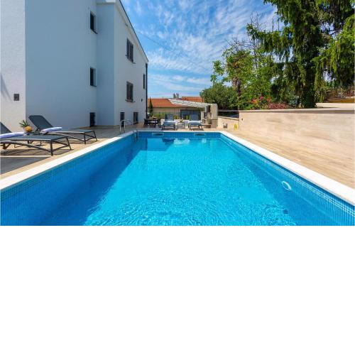Awesome Apartment In Malinska With Outdoor Swimming Pool, Wifi And 2 Bedrooms