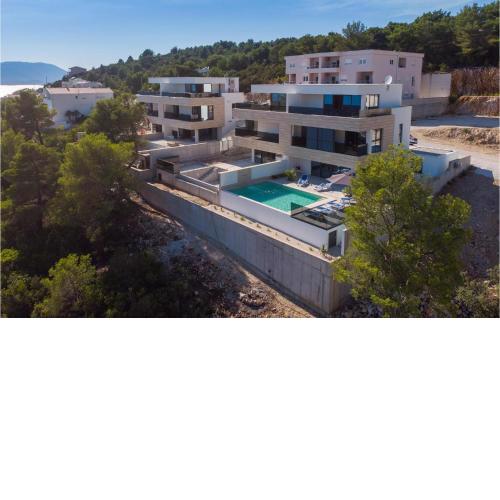 Awesome home in Komarna with Outdoor swimming pool, WiFi and 4 Bedrooms