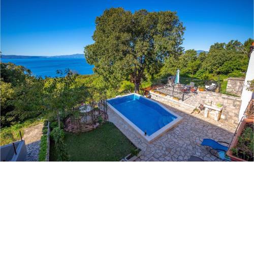 Awesome home in Kostrena with 4 Bedrooms, WiFi and Outdoor swimming pool