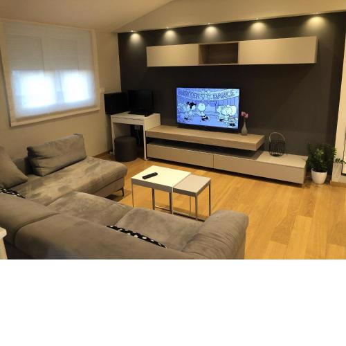 Moderne Ferienwohnung mit Klima, WiFi in Sandstrandnähe